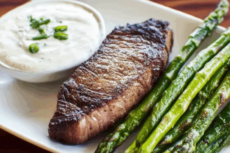 Broiled Steak and Asparagus with Feta Cream Sauce